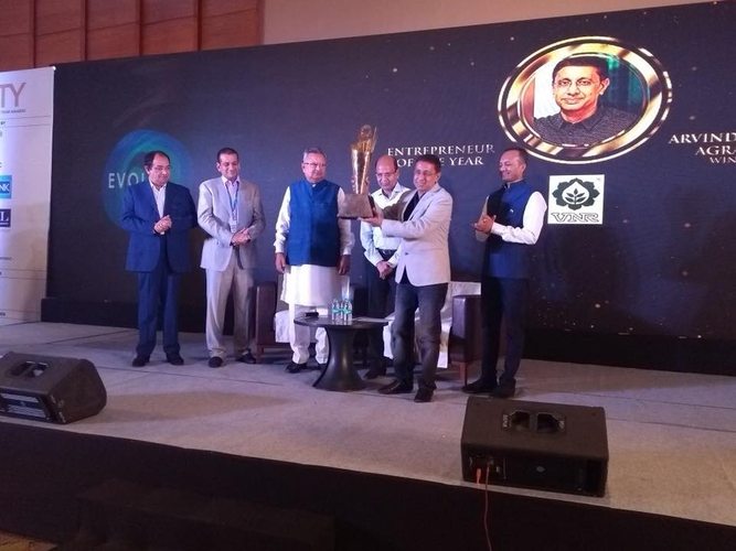 Arvind Agrawal Winner projected on stage screen